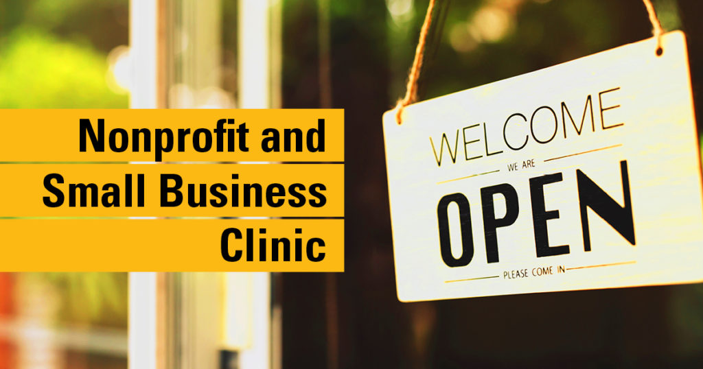 The text "Nonprofit and Small Business Clinic" overlaid on a close-up image of a front door with a Open sign