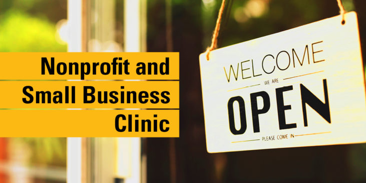 The text "Nonprofit and Small Business Clinic" overlaid on a close-up image of a front door with a Open sign