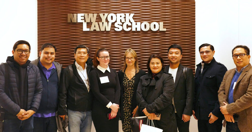 New York Law School's Professor Kim Hawkins and Caitlin Mcguire with the delegation from the Philippines.