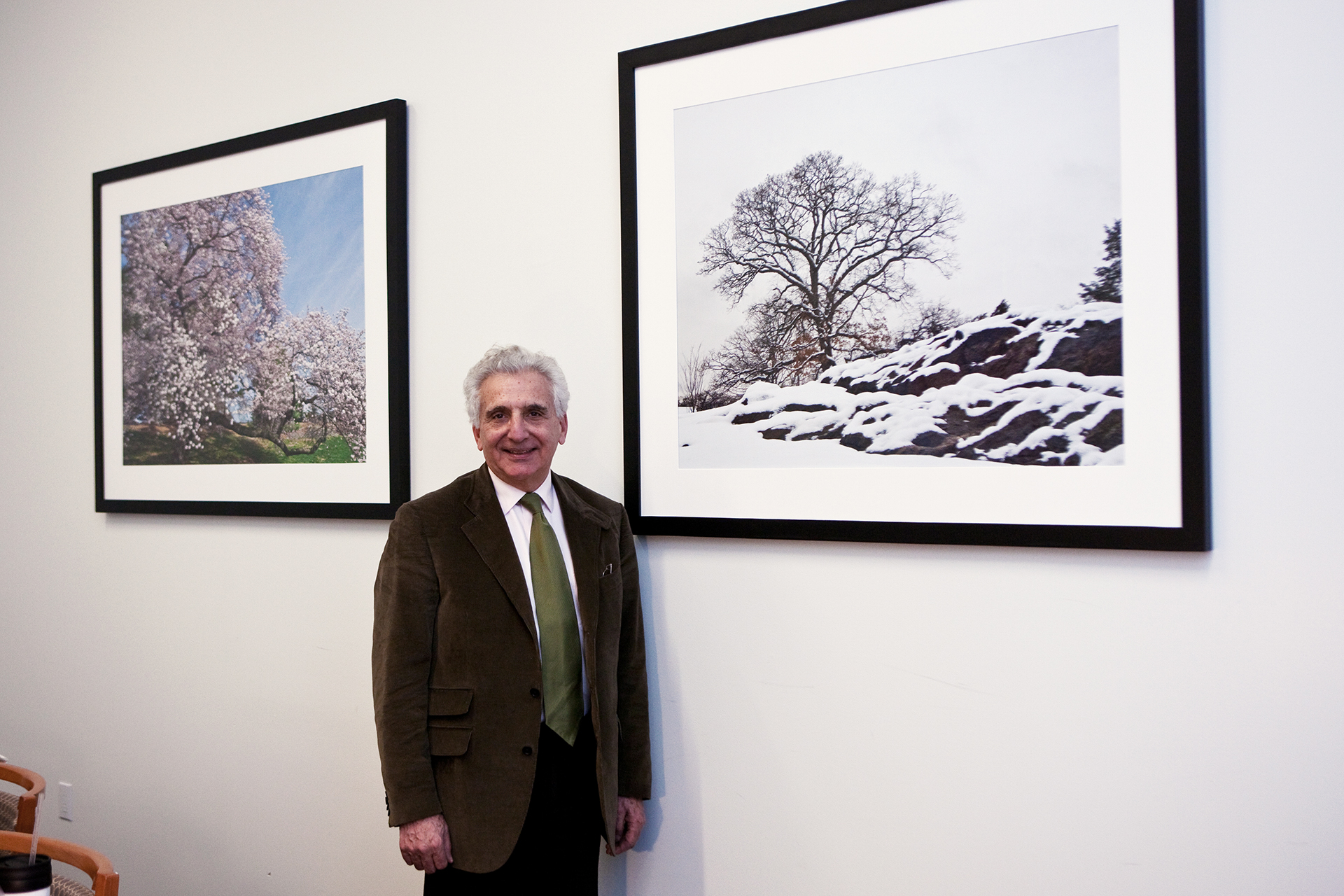 Lawrence Lederman standing in front of his photography