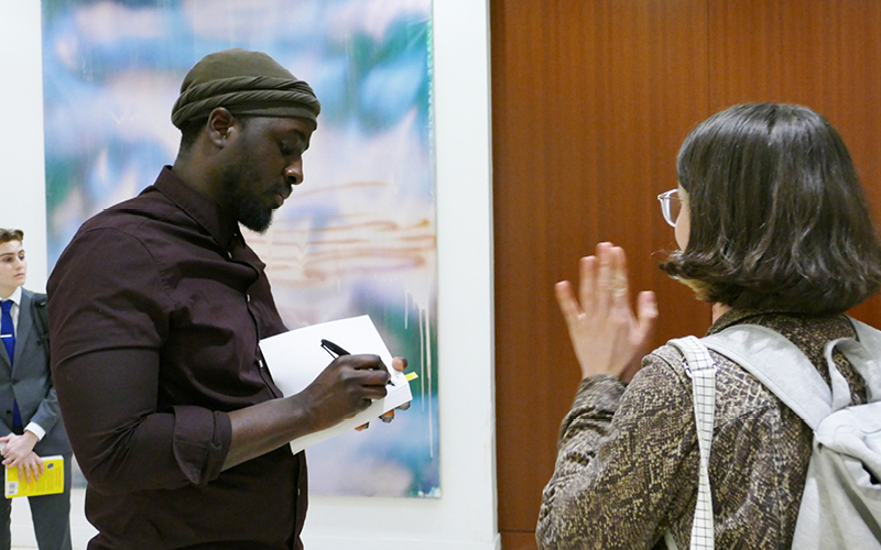 Nana Kwame Adjei-Brenyah signing book