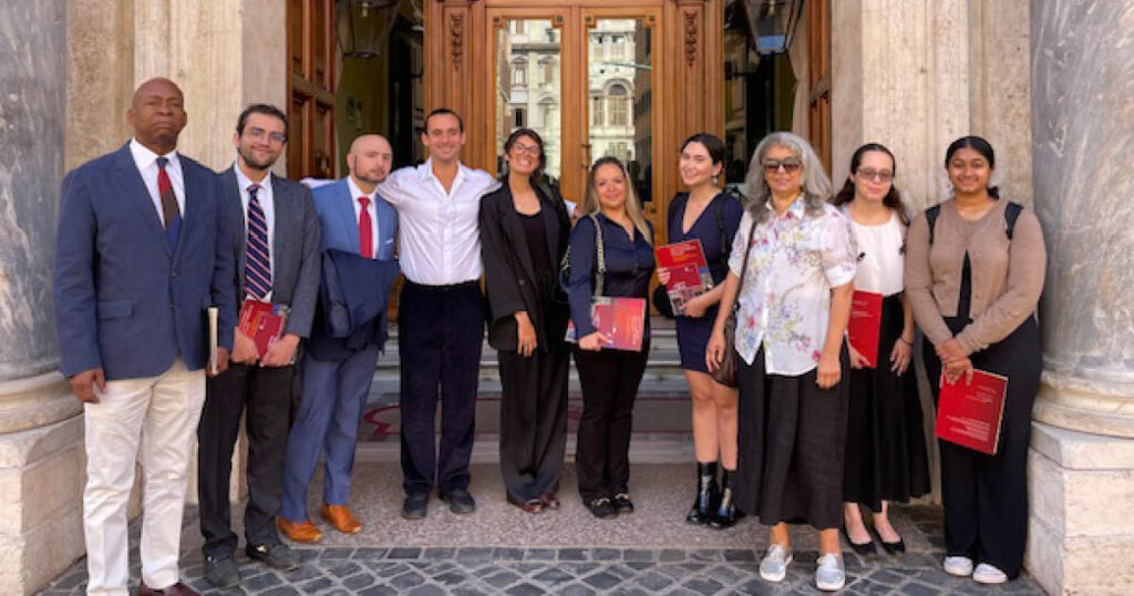 Professor Kirk D. Burkhalter, Professor Penny Andrews, and NYLS students in Rome