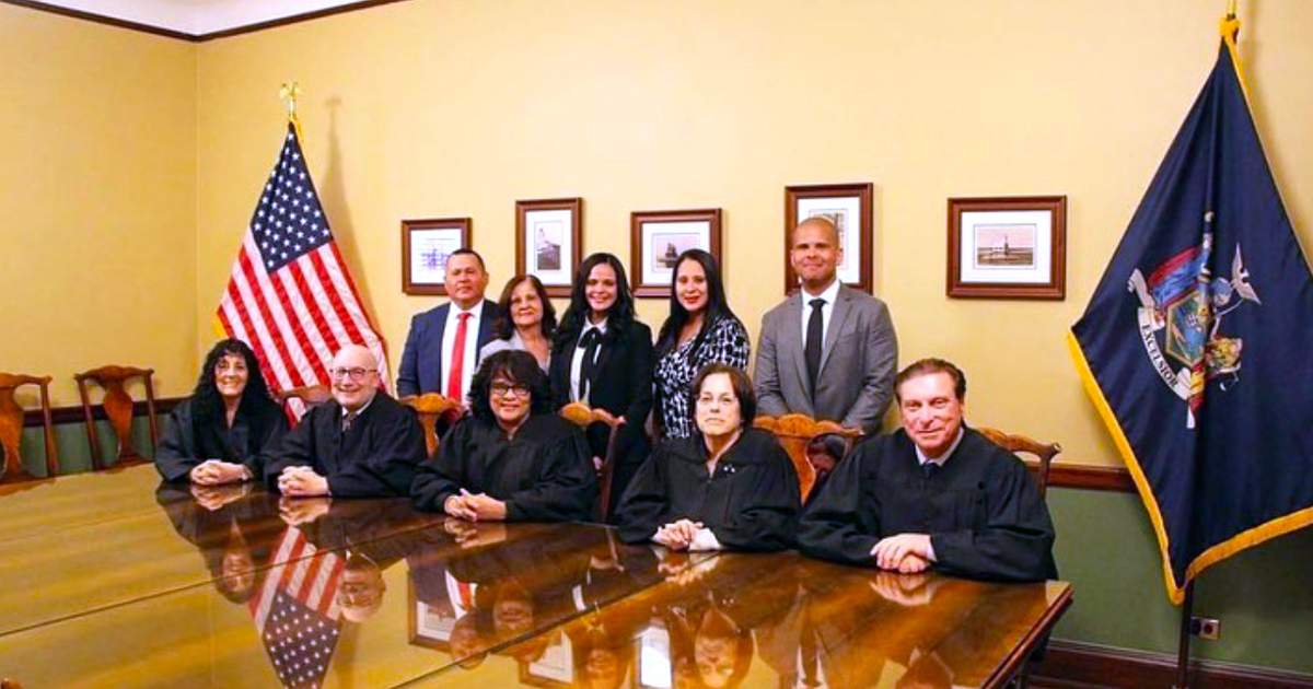 Belliard alongside Justices of the Appellate Division, Second Department, and her family on her admission date.