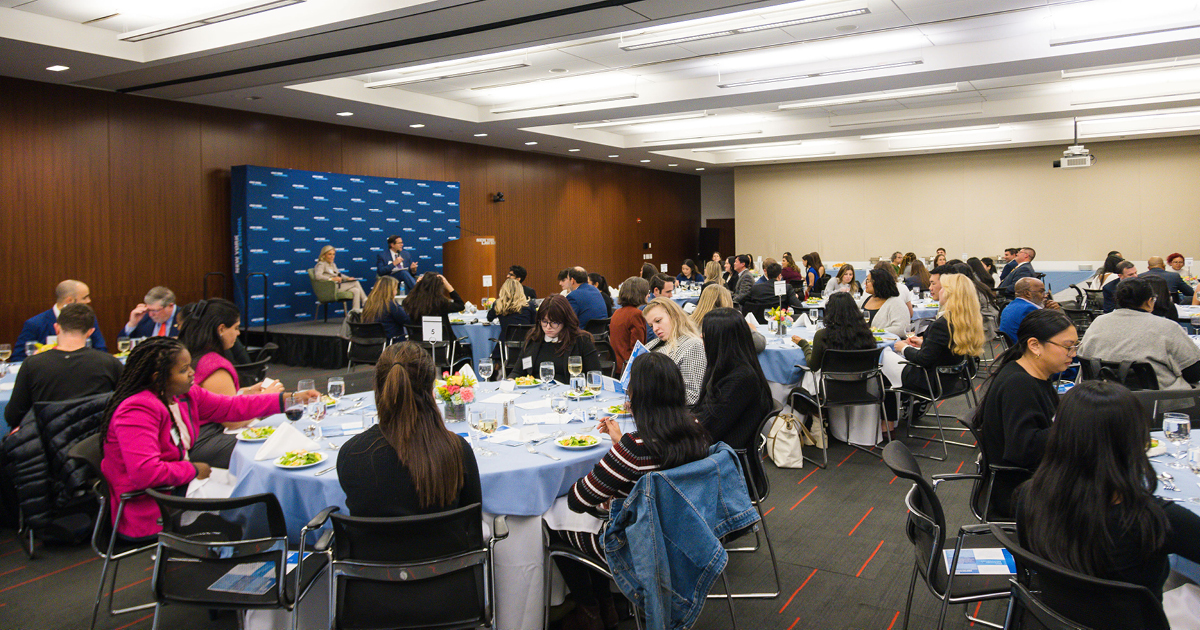 Meryl Fiedler Lieberman and Anthony Crowell speaking at the First Generation Professionals Etiquette Dinner