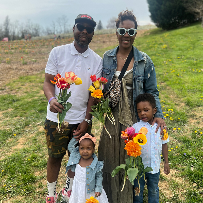 Tarrian Ellis with his wife, Nicole, and their two children